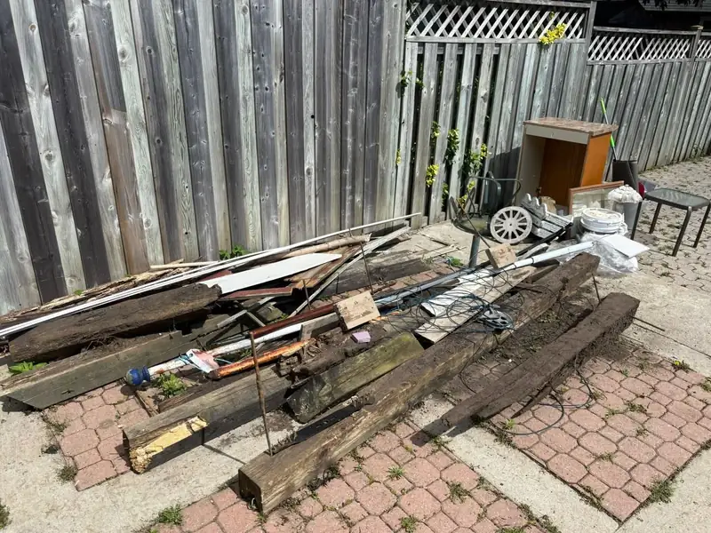 Yard cleared of debris and old lumber by BK Junk Co.