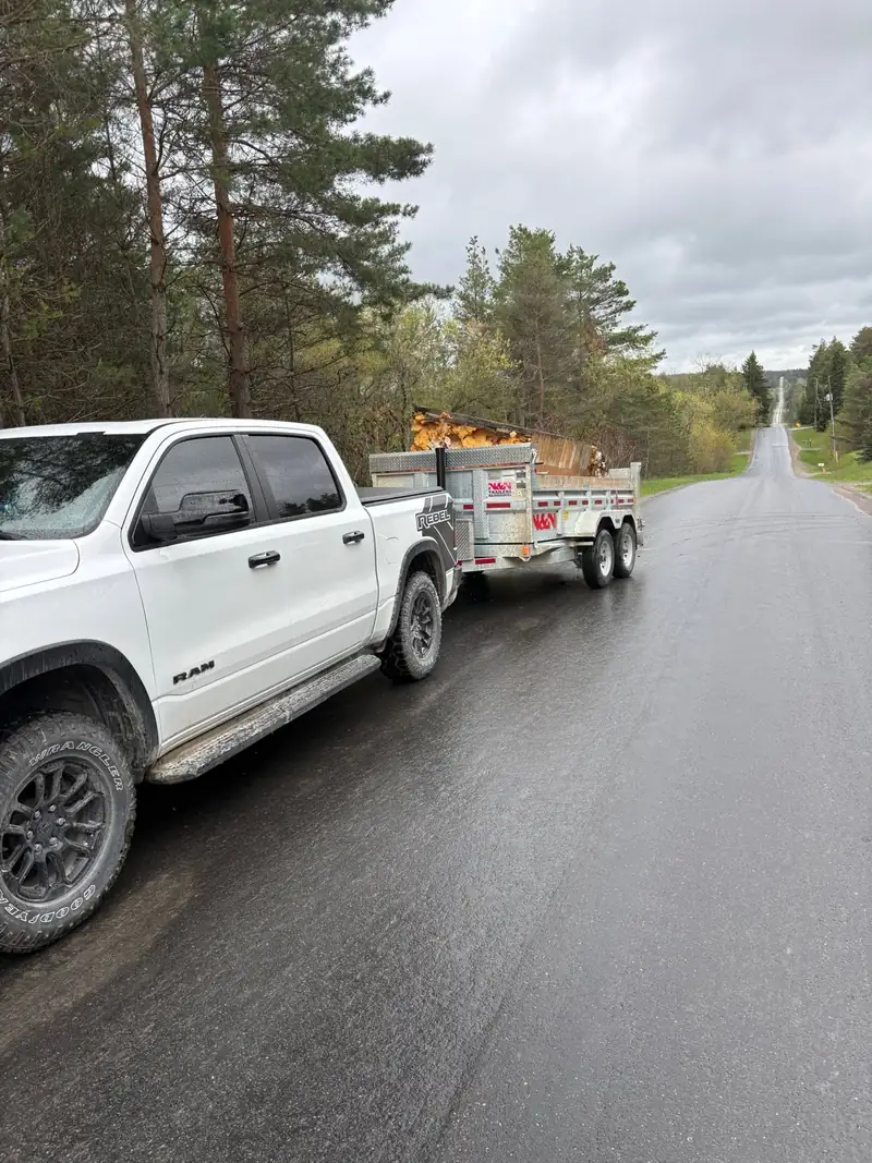 BK Junk Co.'s truck and trailer loaded with debris on a Durham Region road